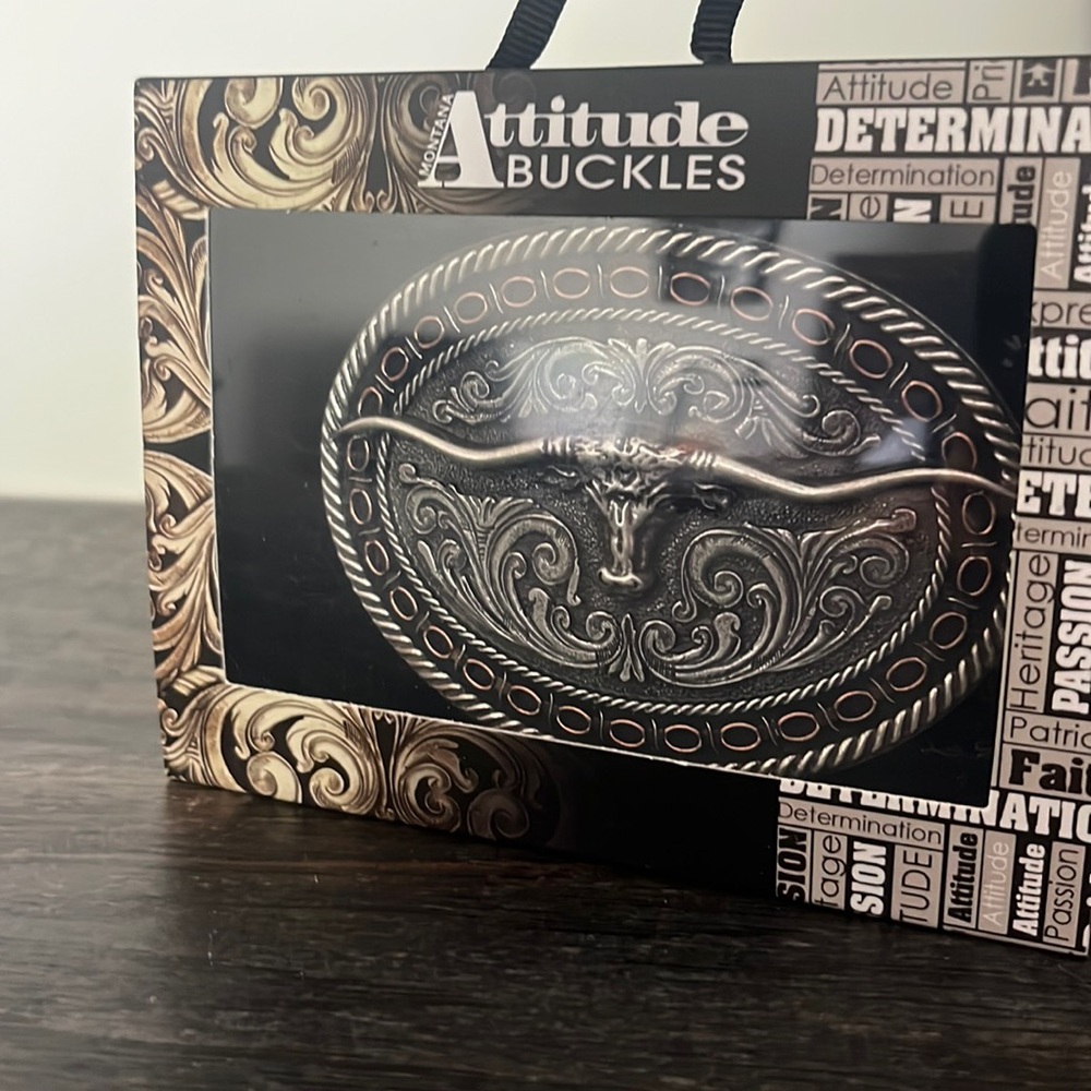 Montana silversmith belt buckle. Barb edge long horn oval.